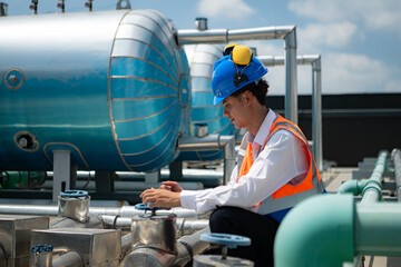 Engineers inspect the completed air conditioning and water systems to continue verifying their...