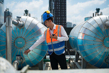 Engineers inspect the completed air conditioning and water systems to continue verifying their...