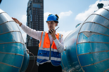 Engineers inspect the completed air conditioning and water systems to continue verifying their...