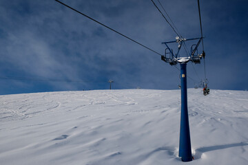 sunny winter morning in the mountains of sheregesh on the ski track.