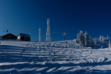sunny winter morning in the mountains of sheregesh on the ski track.