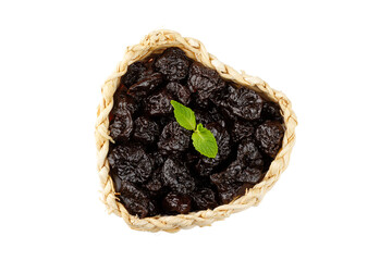 Dried plum in basket isolated on a white background top view