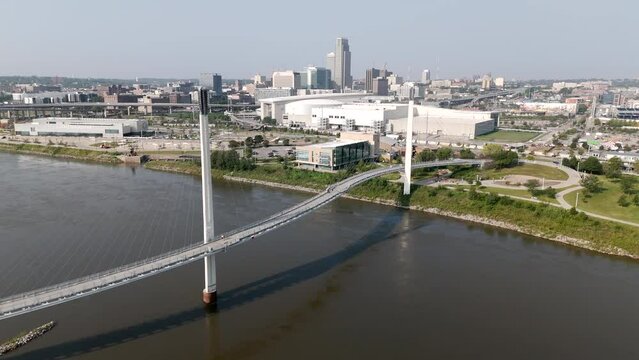 Shot of the Bob Kerrey Pedestrian Bridge in Omaha, with the city skyline in the background.
