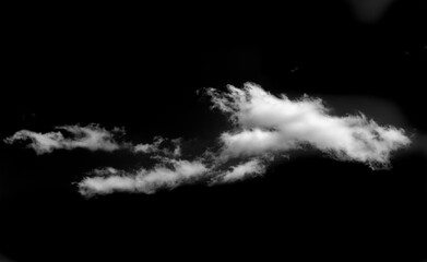 The contrast of the white cloud against the black background creates a striking visual effect....