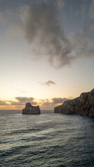Rough sea in Sardinia near Porto Flavia. Aerial view of Pan di Zucchero and crystal clear sea