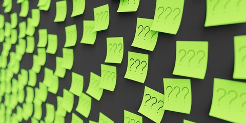 Many green stickers on black board background with three question marks symbol drawn on them....