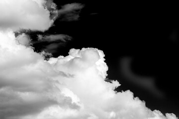 White cloud on a black background. The color contrast creates a striking visual effect. Symbolizes...
