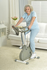 Elderly woman exercising on an exercise bike