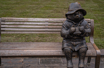 The statue of Paddington sitting on the bench, London