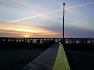 Breathtaking view of bright sun shining over the sea and Motueka natural pool in New Zealand