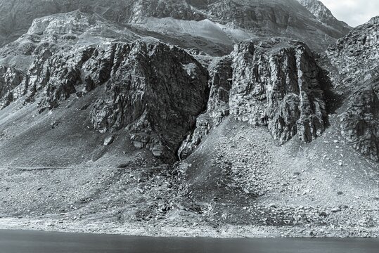 Grayscale shot of rocky hills