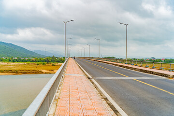 Highway over the bridge.
Central Vietnam, cloudy day.
