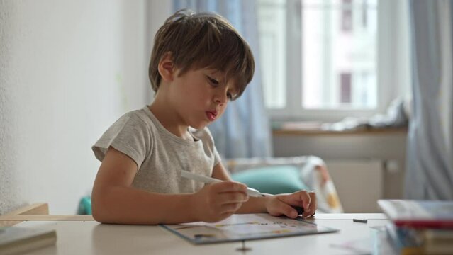 Kid In Room At Desk, Learning Cursive Writing