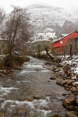snowy river in a beautiful mountain town

