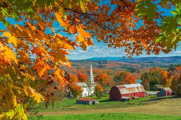 Peacham Vermont church next to houses in the autumn