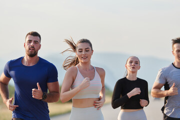 A group of friends maintains a healthy lifestyle by running outdoors on a sunny day, bonding over fitness and enjoying the energizing effects of exercise and nature