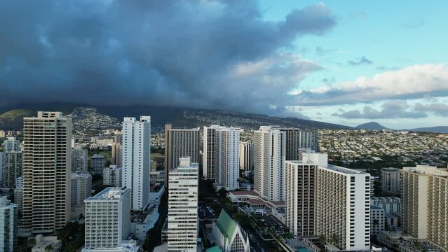 Aerial view of the buildings in Hawaii island with dark clouds hanging over them