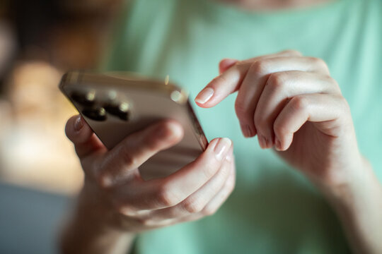 Close-up of a woman's hands using a smartphone