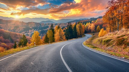Black asphalt road landscape at sunset in beautiful colorful nature. Highway scenery among mountains in autumn season. Nature landscape on beautiful road in colorful fall. Autumn landscape in Germany - obrazy, fototapety, plakaty