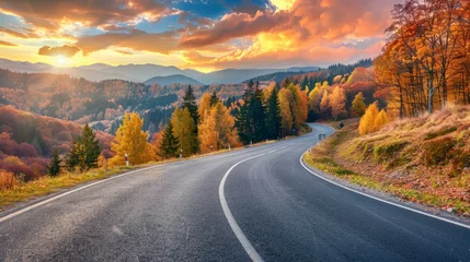 Tafelkleed Black asphalt road landscape at sunset in beautiful colorful nature. Highway scenery among mountains in autumn season. Nature landscape on beautiful road in colorful fall. Autumn landscape in Germany © Nijat