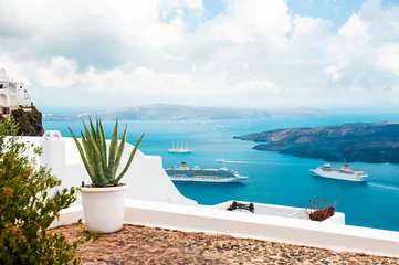 Foto op Canvas White architecture in Santorini island, Greece. Beautiful terrace with sea view. © smallredgirl