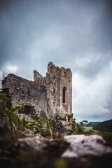 Fototapeta premium Ruins of a medieval castle under the gloomy sky