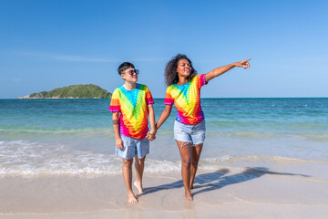 LGBTQ couple lover holding hand pose happiness life on beach in summer holidays vacation is friendship freedom equality of love concept.