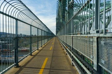 Path on a bridge with its protective barrier in the city of Montreal, Canada