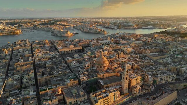 Aerial shot of Valletta old town in Malta during sunset. Flying over Valletta city, Malta 