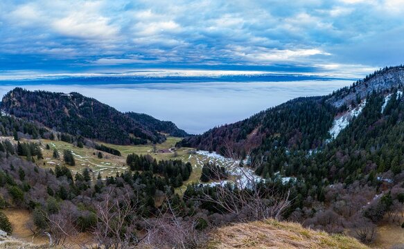 Scenic view of the Seeland region from Grenchenberg Mountain on a foggy day in Switzerland