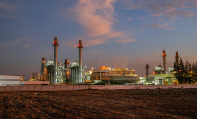 Fototapeta na wymiar Natural Gas Combined Cycle Power Plant ,Gas turbine electrical power plant with in Twilight power for factory energy concept.