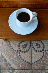 Espresso coffee on dark wooden table. 