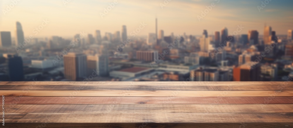 Poster wooden surface of a table displaying a distant view of a city with buildings and structures