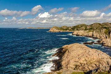 Rocky coast of Norway, mountains covered with moss and grass strong currents and dangerous cliffs....