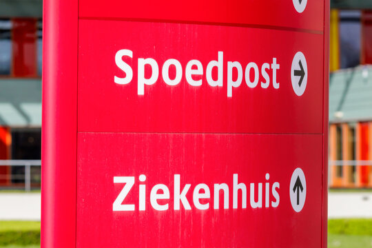 Route information sign with the Dutch text for "Emercengy care" and "Hospital" in The Netherlands
