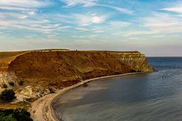White Cirrus clouds in the blue sky on the Alexander graben. Steep cliff on the bank of the Volga...