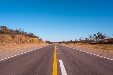 Fototapeta na wymiar Empty highway leading to the Santiago del Estero, Argentina