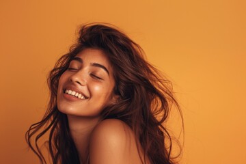 Joyful Skincare Portrait of Middle Eastern Model with Long Wavy Hair


