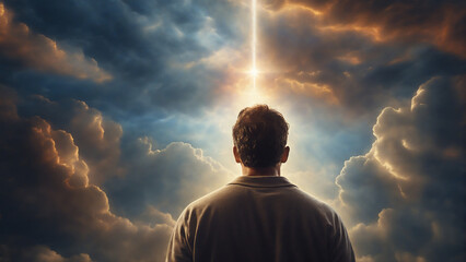 A man experiencing spiritual light from the sky - obrazy, fototapety, plakaty