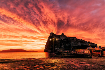 Aragonese castle red sunrise - obrazy, fototapety, plakaty