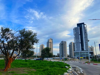 Fototapeta premium Streets of Tel Aviv as seen from a car. New high-rise buildings, old buildings, construction of new buildings.