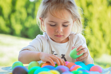 Little Boy Coloring Easter Eggs