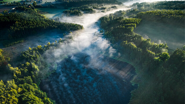 Mist over river at sunrise. Aerial view of nature.
