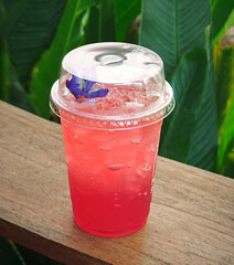 a cup of strawberry soda cool juice
