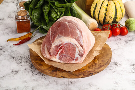 Uncooked raw pork knuckle with spices