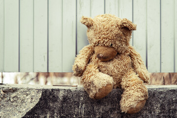 forsaken bear toy, domestic violence, loneliness, depression, upset frustrated mental state. concept