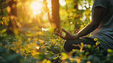 Close-up photograph of a serene individual meditating in a sunlit tranquil forest - obrazy, fototapety, plakaty