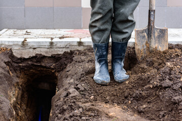 Earth trench dug to lay pipe or optical fiber.