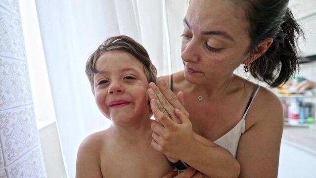 Little Boy Finds Comfort And Solace In Mother’s Lap After Wound Care