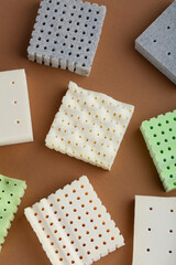Technology Concept, pillow and mattress material. Nature para latex rubber perforated on brown backgroud. For filling a mattress layers